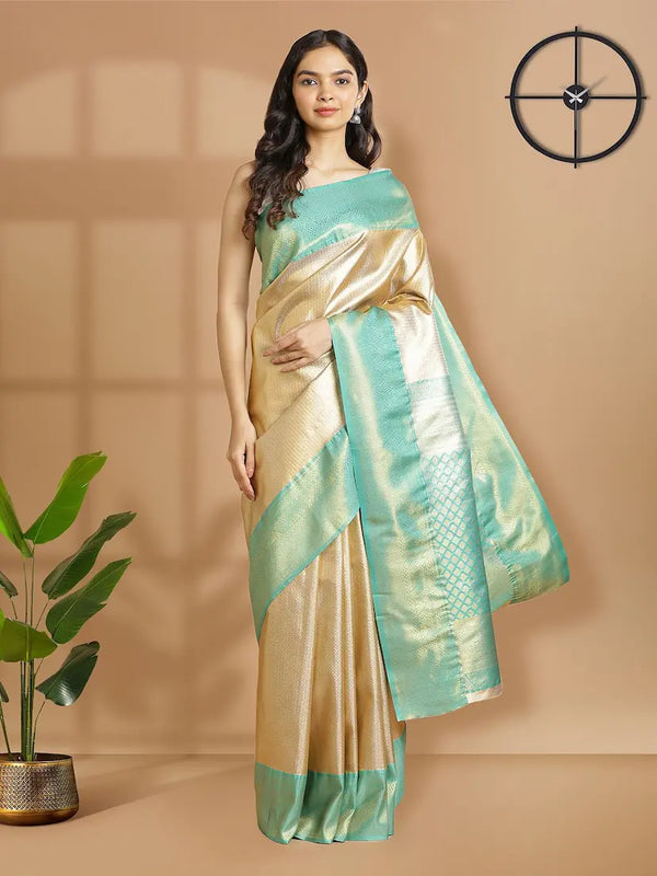 Silver With Golden Tissue Saree With Self Woven Design Over Body And Green Border
